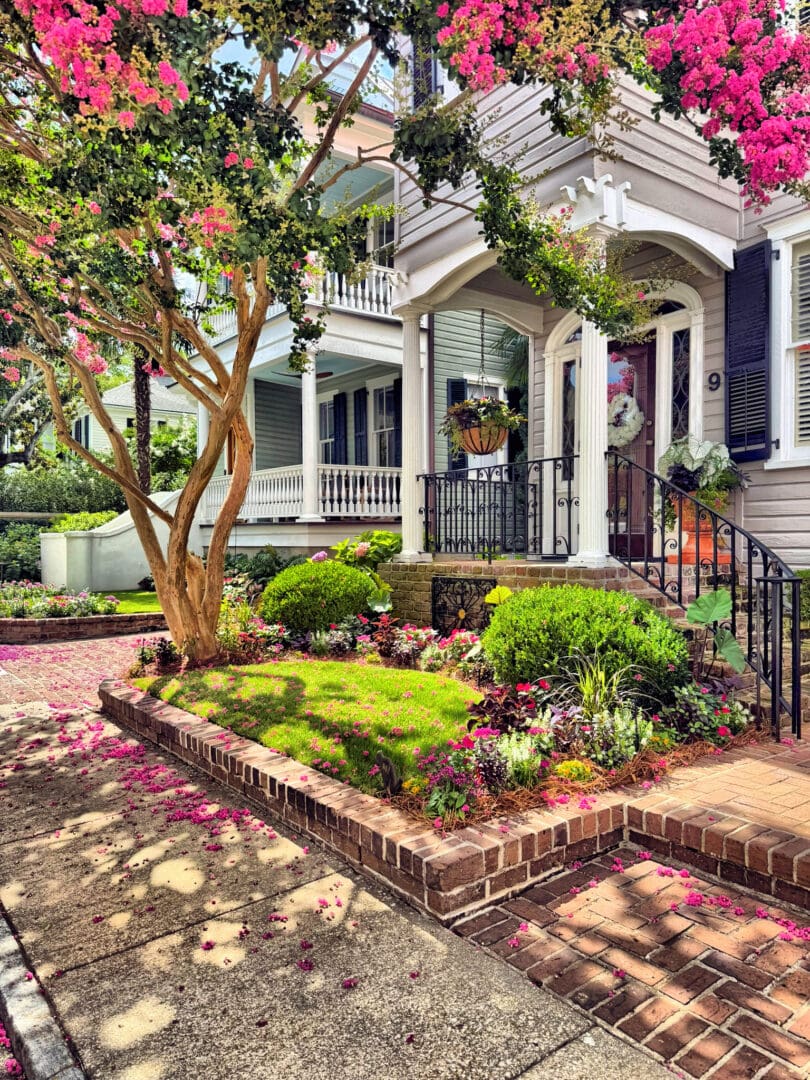 Porch framed by pink crepe myrtle